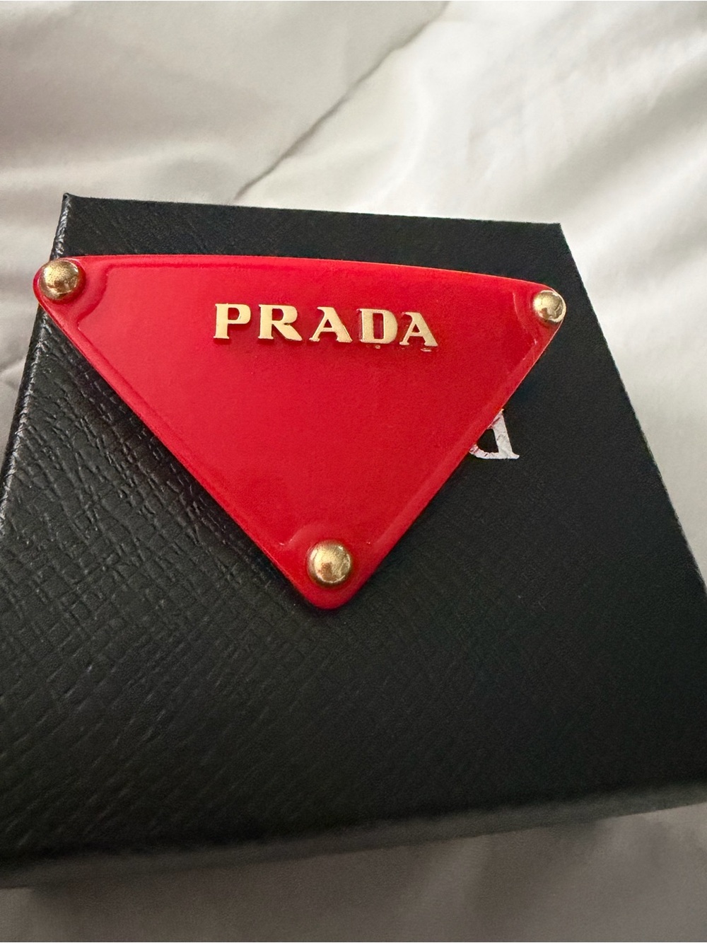 Prada Red Triangle Logo Badge Hair Clip with Gold Accents